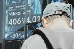 Wall Street tiptoes around its records as its busy week picks up momentum