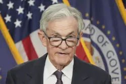 Fed Governor Breaks With Powell